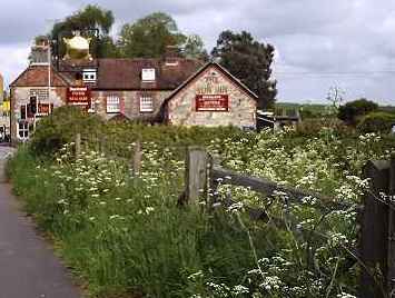 The Sun Inn's beer garden is surrounded by
 hedges and fields.